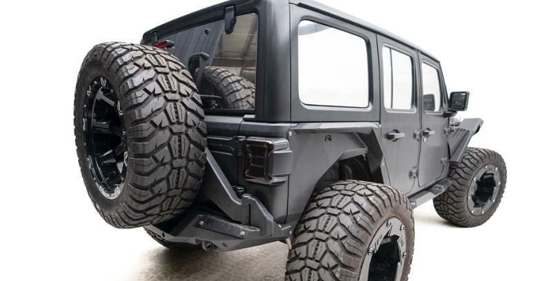 The New 2020 Jeep Wrangler JL Door Tire Carrier by Fab Fours! | Fab Fours